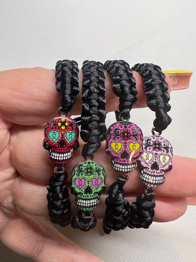 Silver Candy Skulls made by hand with string.