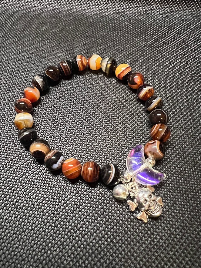 Sardonyx 8mm Bead with half moon and silver spacers and charms.